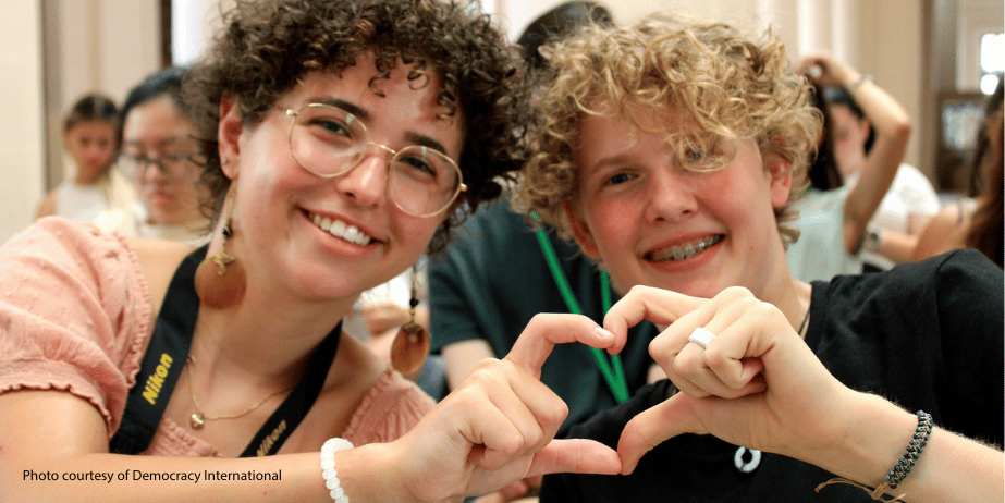 Young people shaping heart with their hands